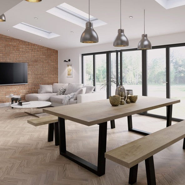 Stylish dining room featuring a statement Solid oak dining tables setup with coordinated interior décor and modern seating.