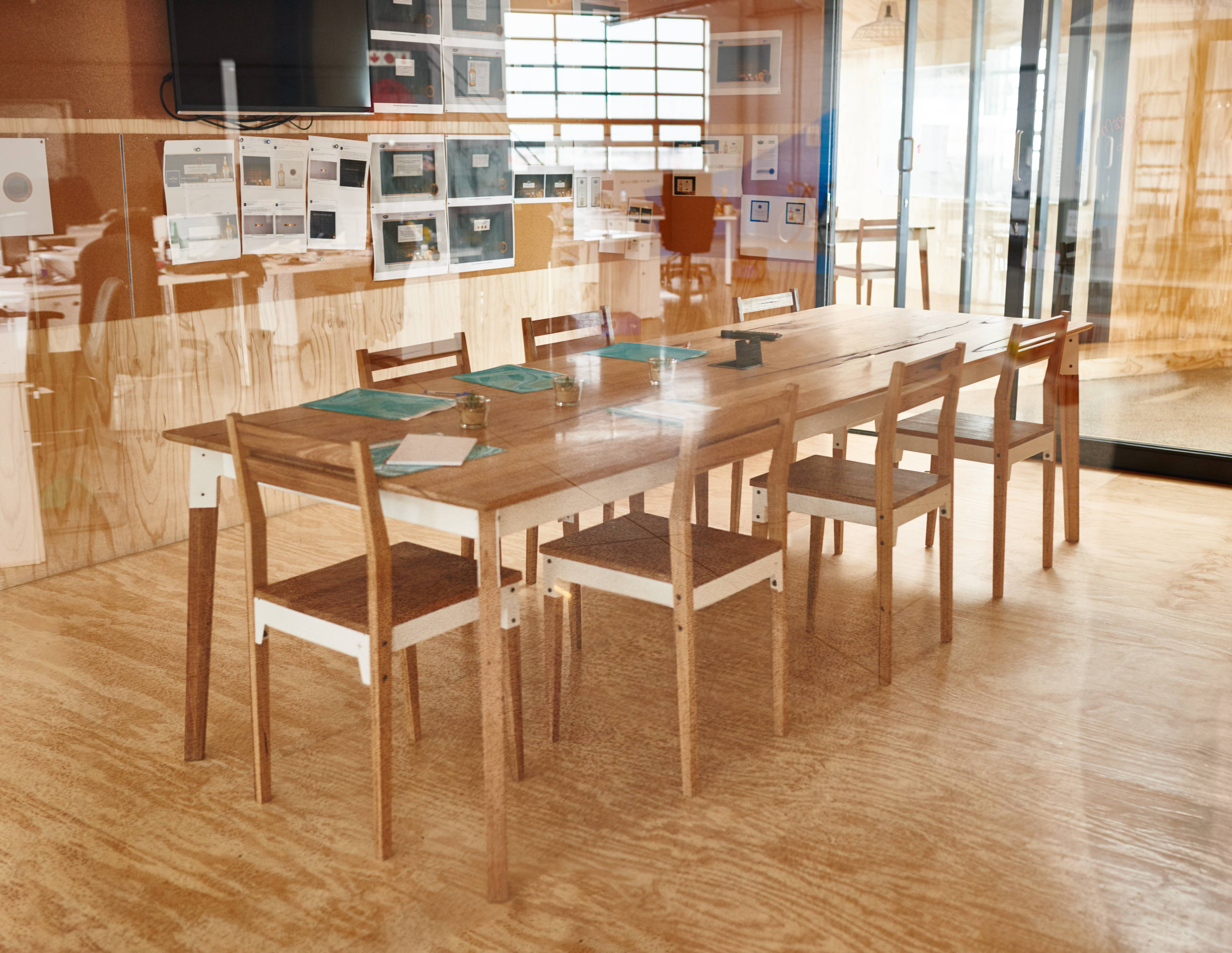 Oak Dining table styled with chairs and simple décor in a bright dining space.