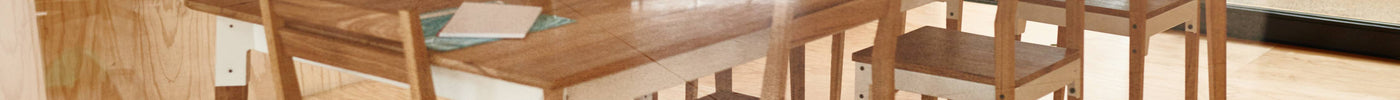 Oak Dining table styled with chairs and simple décor in a bright dining space.