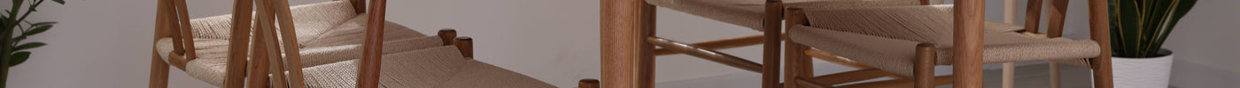 Oak dining tables in a modern dining room with wooden chairs and natural interior décor.